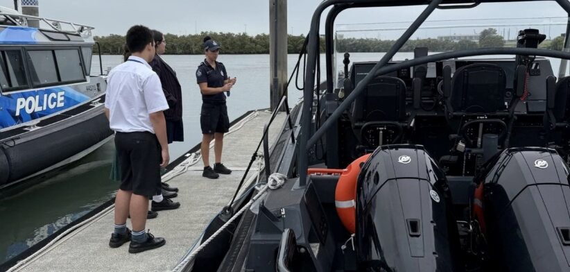 School students and Queensland Police Service boat. | Newsreel