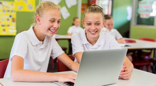 Students on a computer. | Newsreel