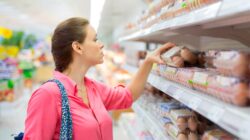 Woman shopping for eggs. | Newsreel