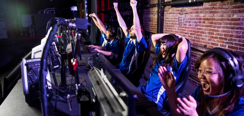 Esports players celebrate. | Newsreel