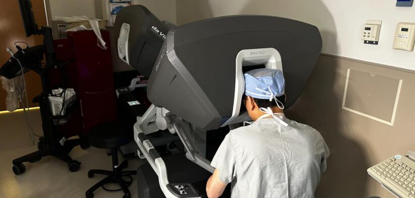 Dr Kenneth Liao with a robotic surgery machine. | Newsreel