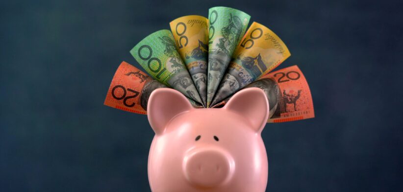 Piggy bank with Australian dollars. | Newsreel