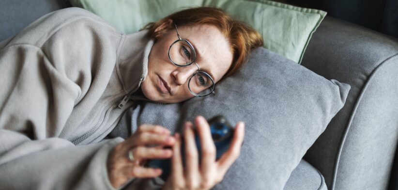 Woman sad on phone. \ Newsreel