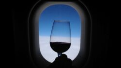 Glass of wine on plane.