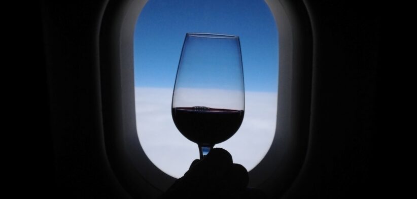 Glass of wine on plane.