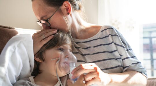 Mother with sick child. | Newsreel