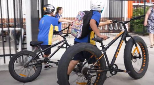 Children cycling to school. | Newsreel