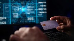 Person making credit card payment on computer. | Newsreel