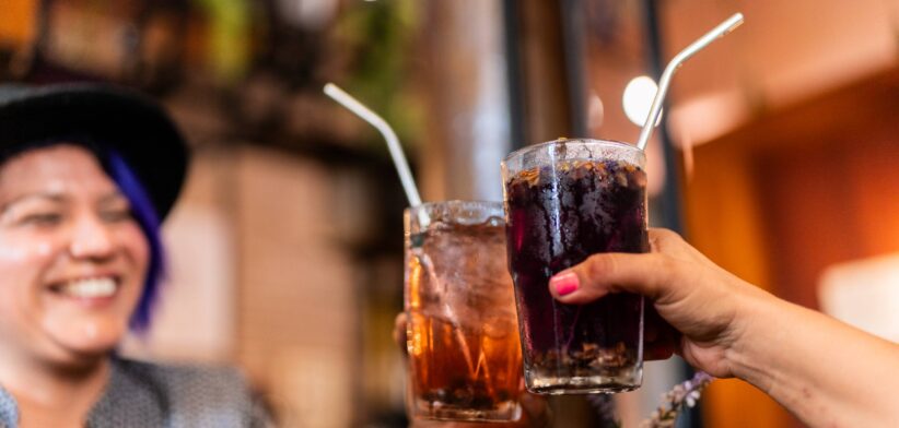 Couple cheersing with soft drink. | Newsreel