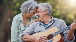 Elderly man playing guitar. | Newsreel
