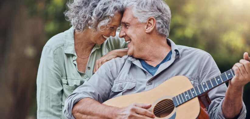 Elderly man playing guitar. | Newsreel