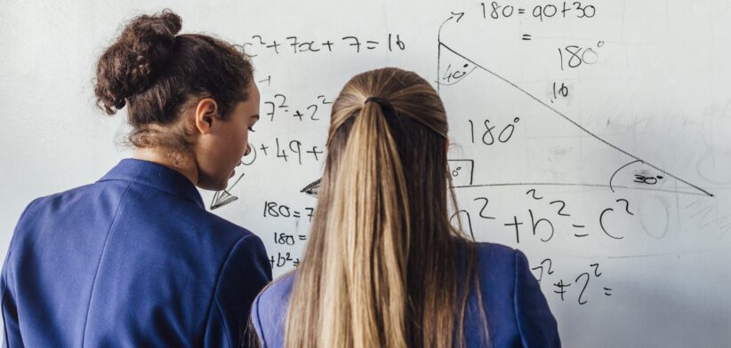 Students solving maths problem. | Newsreel