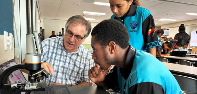 QIMR researcher with students in Far North Queensland