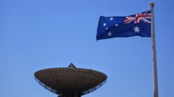 Satellite dish and Australian flag. | Newsreel
