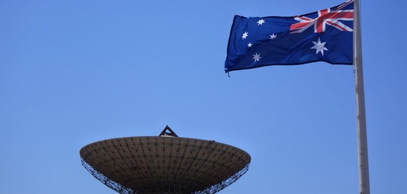 Satellite dish and Australian flag. | Newsreel