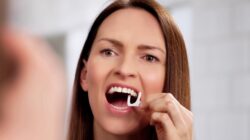 Woman flossing. | Newsreel
