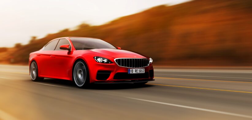 Red car on road. | Newsreel