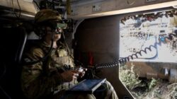 Private Eid Muhammad, from the 1st Armoured Regiment, controls the M134D minigun remote weapon station attached to a Modular Robotic Vehicle during Exercise Talisman Sabre.