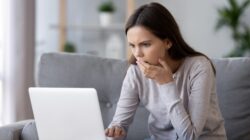 Woman worried looking at computer. | Newsreel