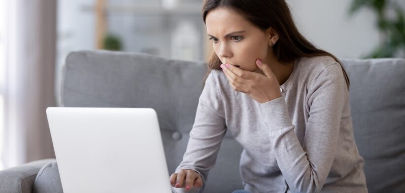 Woman worried looking at computer. | Newsreel