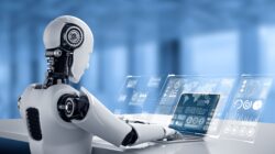 Robot at computer. | newsreel