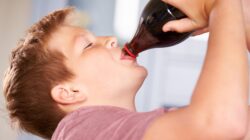 Child drinking cola. | Newsreel