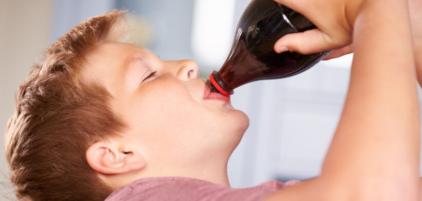 Child drinking cola. | Newsreel