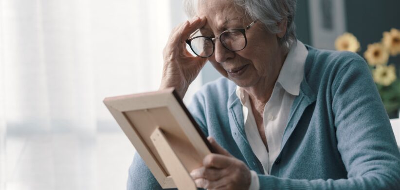 Elderly woman grieving. | Newsreel