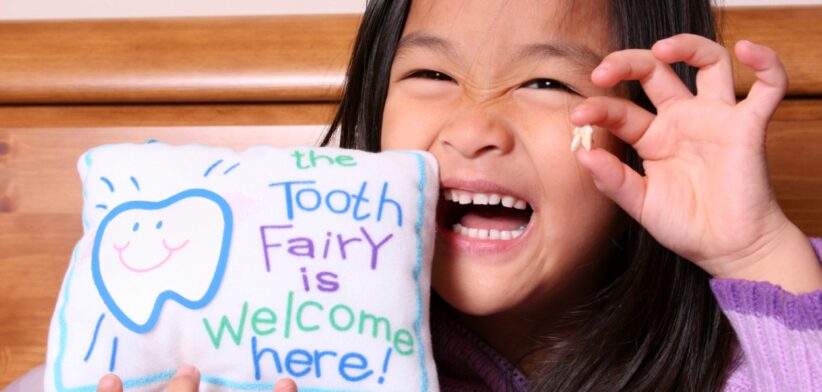 Child with tooth for tooth fairy. | Newsreel
