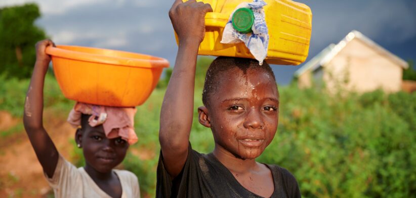 Children collection water. | Newsreel