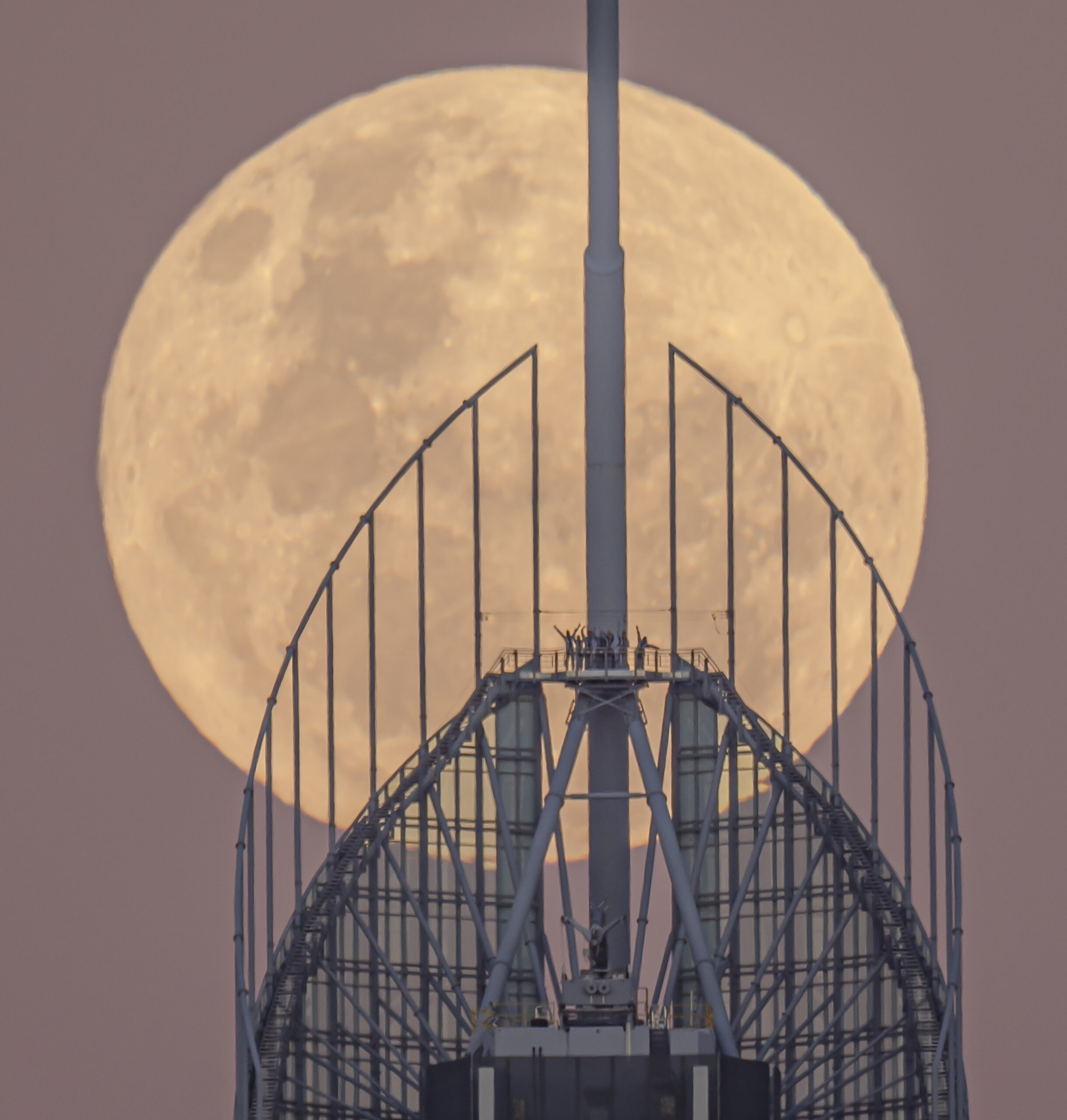 Honourable mention in the David Malin Award's People and Sky category: Kelvin Hennessy, “Full Moon with Waving Q1 Climbers.” | Newsreel