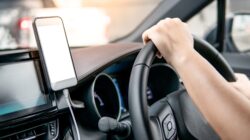 Phone in car. | Newsreel