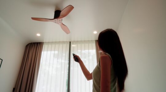 Woman using ceiling fans. | Newsreel