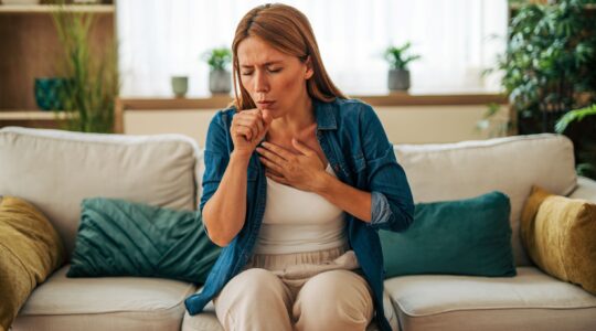 Woman coughing. | Newseel