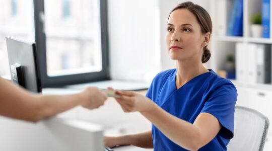 Payment made at doctor's surgery. | Newsreel