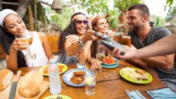 Friends at a restaurant. | Newsreel
