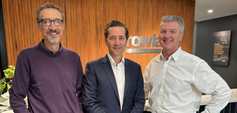 Rowland Managing Director Alasdair Jeffrey, left, and Chairman Geoff Rodgers, right, welcome Scott Jenson. | Newsreel