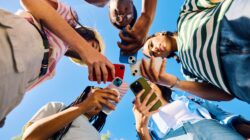 Young people on phones. | Newsreel