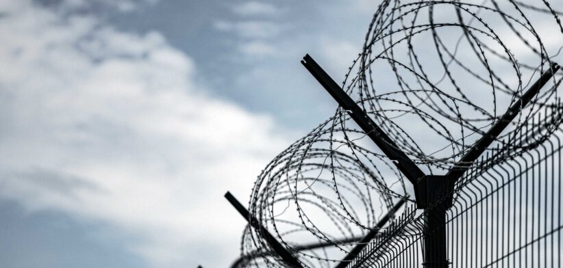 Prison fence. | Newsreel