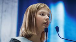 Young girl at microphone. | Newsreel
