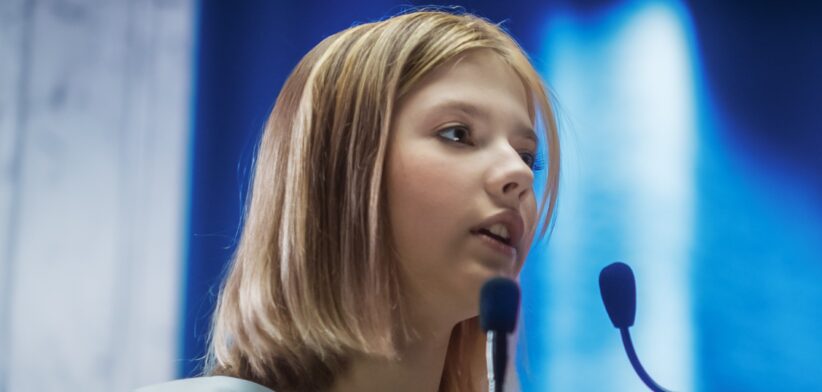 Young girl at microphone. | Newsreel