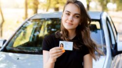 Young woman with drivers licence.