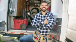 Tradie at back of van. | Newsreel