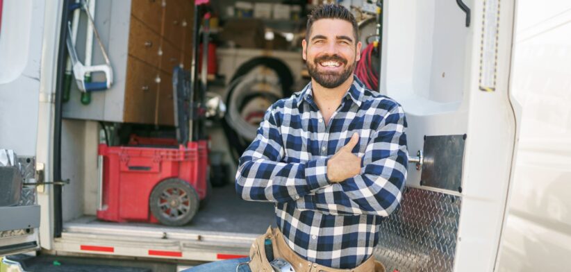 Tradie at back of van. | Newsreel