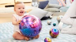 Baby with ball. | Newsreel