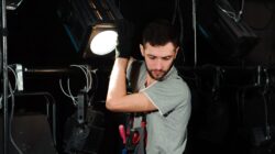 Theatre lighting technician. | Newsreel