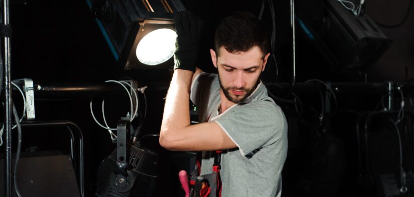 Theatre lighting technician. | Newsreel