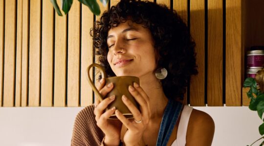 Woman with cup of coffee. | Newsreel