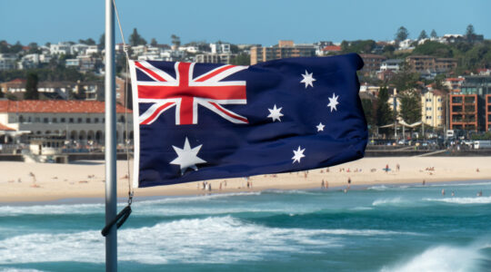 An Australian flag at half mast at Bondi Beach.