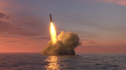Ballistic missile launch from underwater at sunset